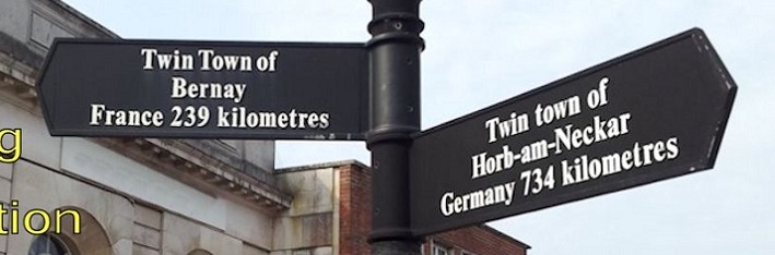 Twin towns signpost
